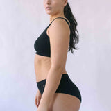 Woman wearing the Six Ada seamless ribbed nursing bra and high waisted knicker. Comfortable and supportive and suitable for pregnancy and breastfeeding.