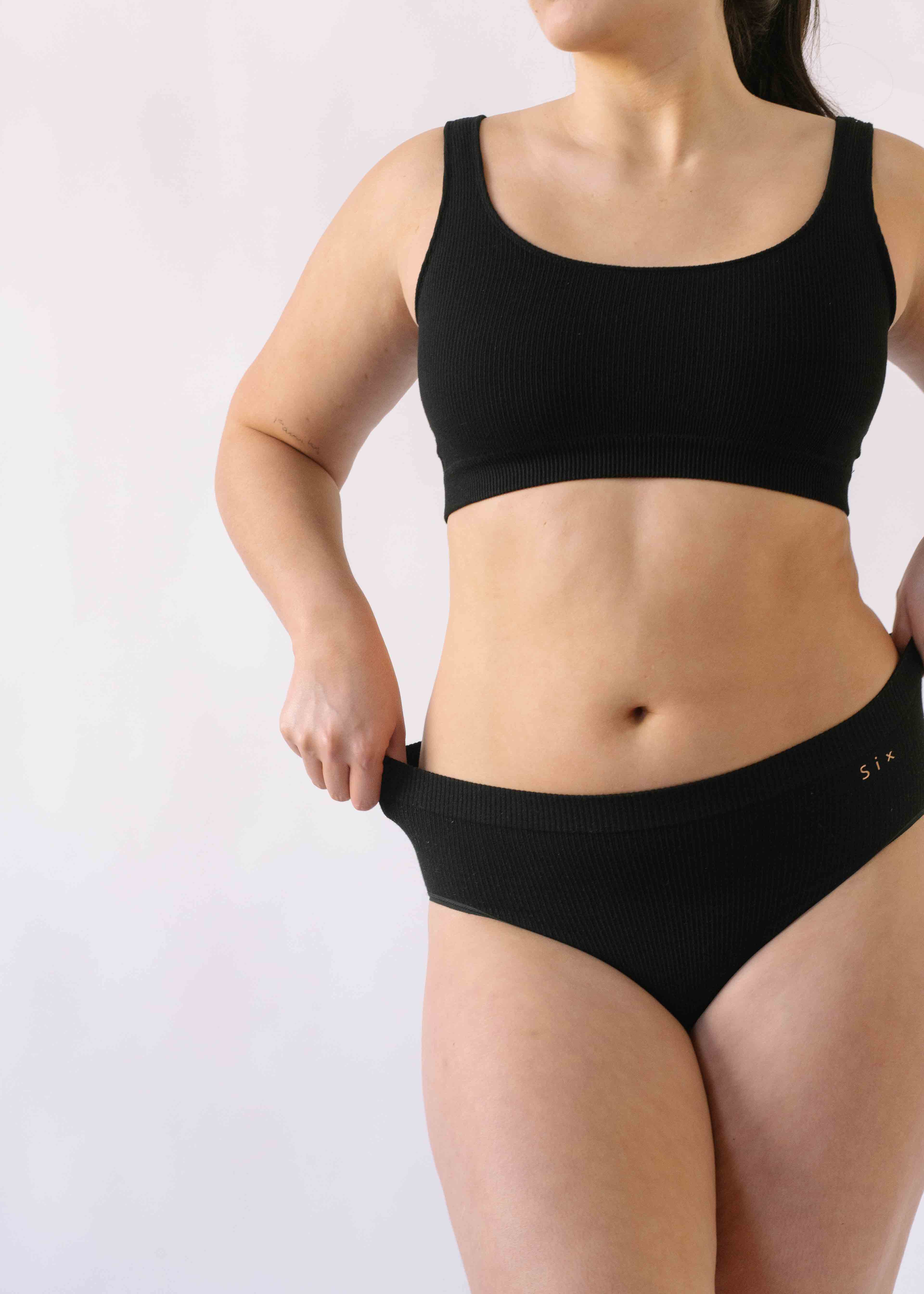 Woman wearing Black Six Ada seamless supportive and comfortable underwear for pregnancy, maternity, breastfeeding and beyond