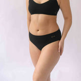 Woman wearing the Six Ada seamless ribbed nursing bra and high waisted knicker. Comfortable and supportive and suitable for pregnancy and breastfeeding.