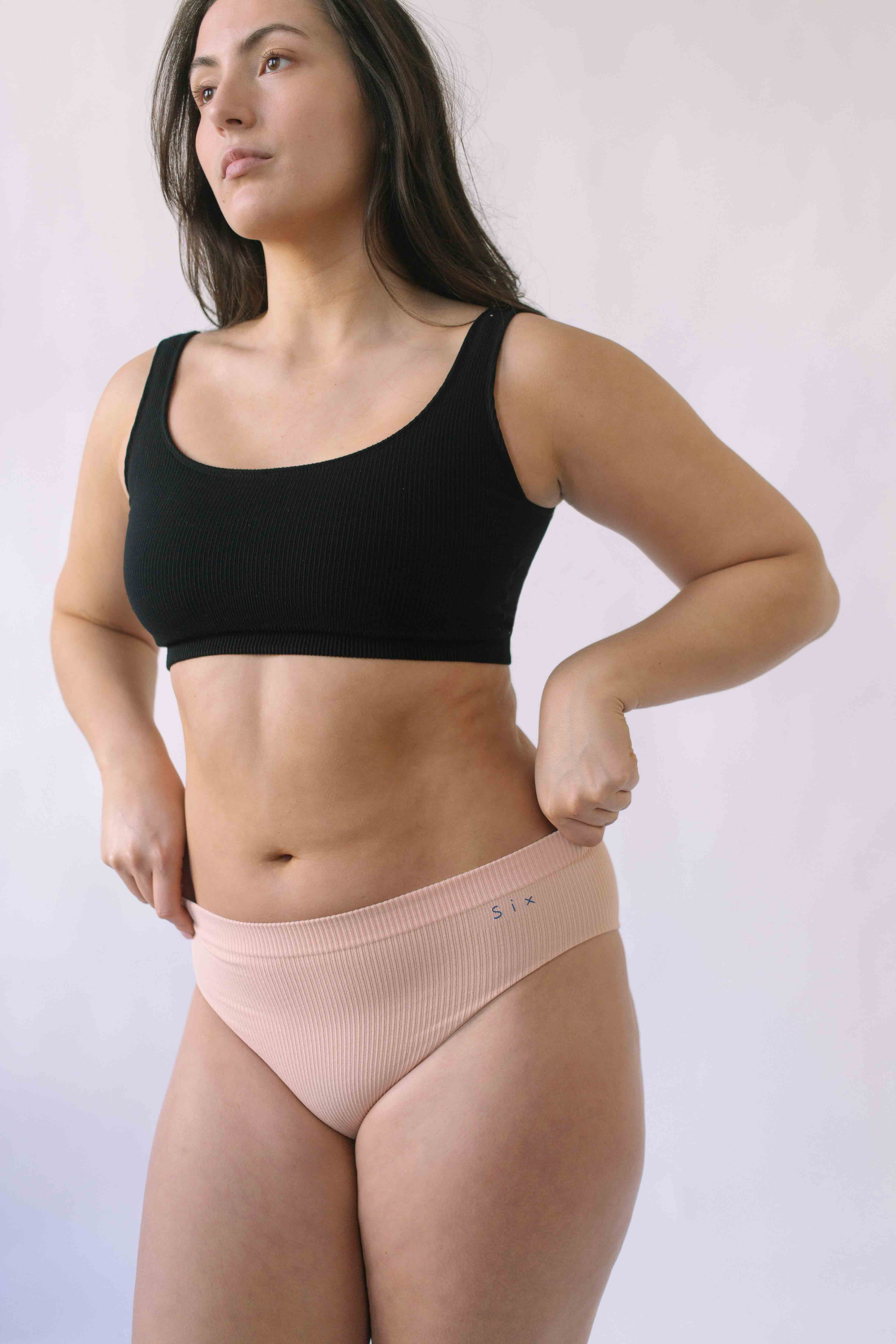 Woman wearing Black Six Ada seamless Bralette and deep knickers, Supportive and comfortable underwear for pregnancy, maternity, breastfeeding and  yoga