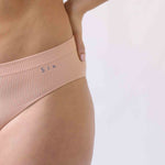 Woman wearing the Ada ribbed seamless high waisted knicker from Six. Suitable to wear throughout pregnancy, maternity and as a supportive post C section knicker.
