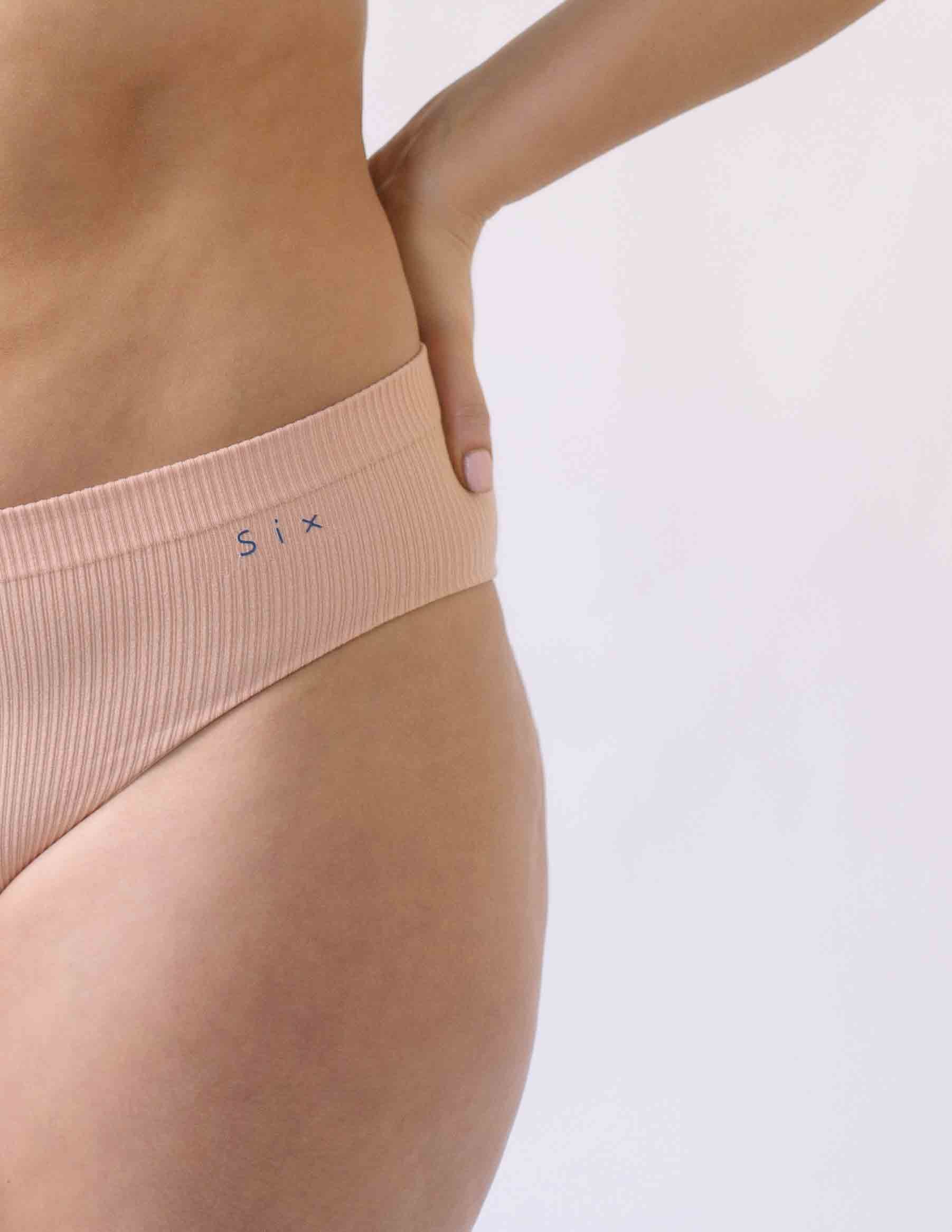 Woman wearing the Ada ribbed seamless high waisted knicker from Six. Suitable to wear throughout pregnancy, maternity and as a supportive post C section knicker.