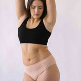 Woman wearing Black Six Ada seamless Bralette and deep knickers, Supportive and comfortable underwear for pregnancy, maternity, breastfeeding and  yoga