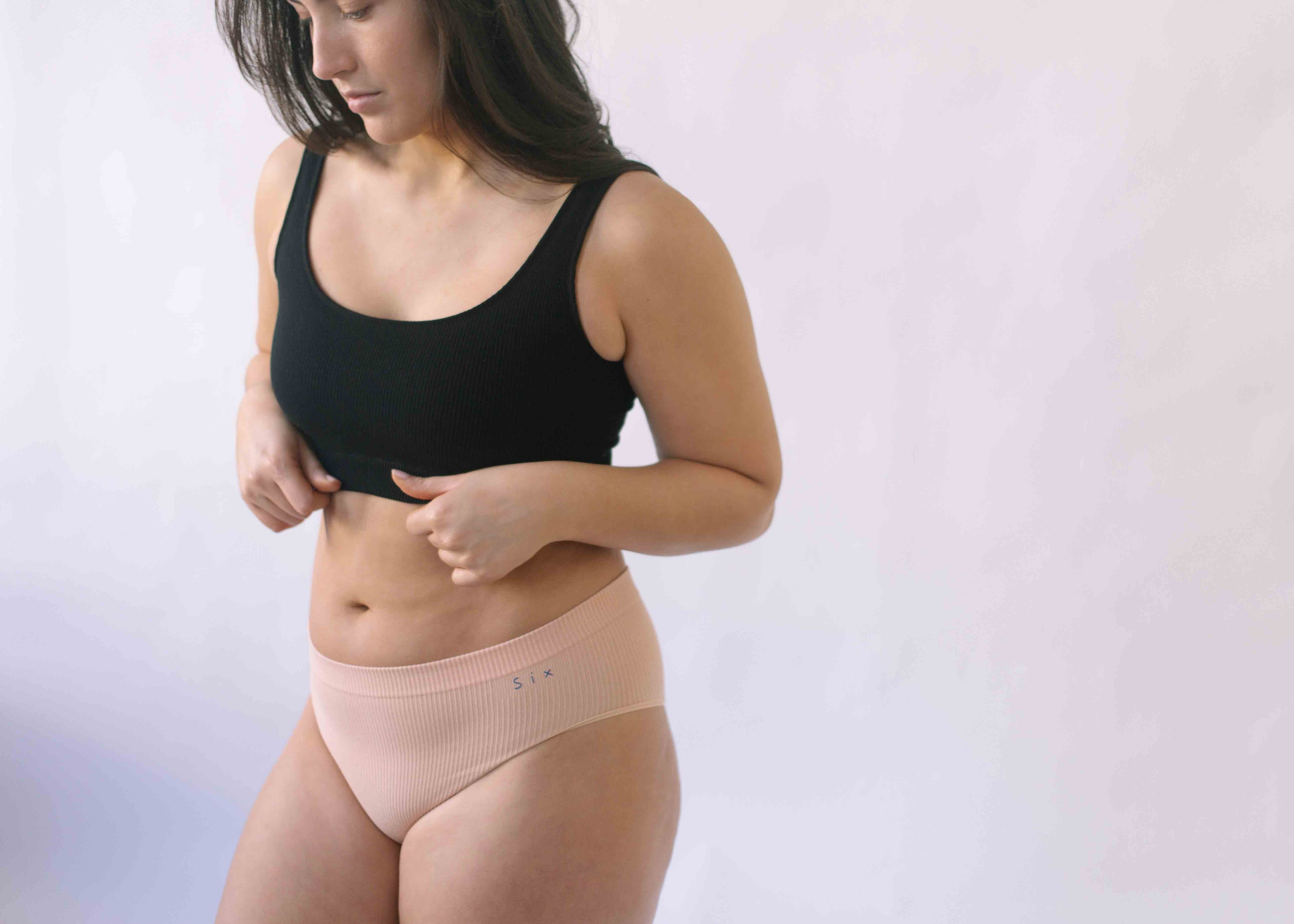 Woman wearing Black Six Ada seamless Bralette and deep knickers, Supportive and comfortable underwear for pregnancy, maternity, breastfeeding and  yoga