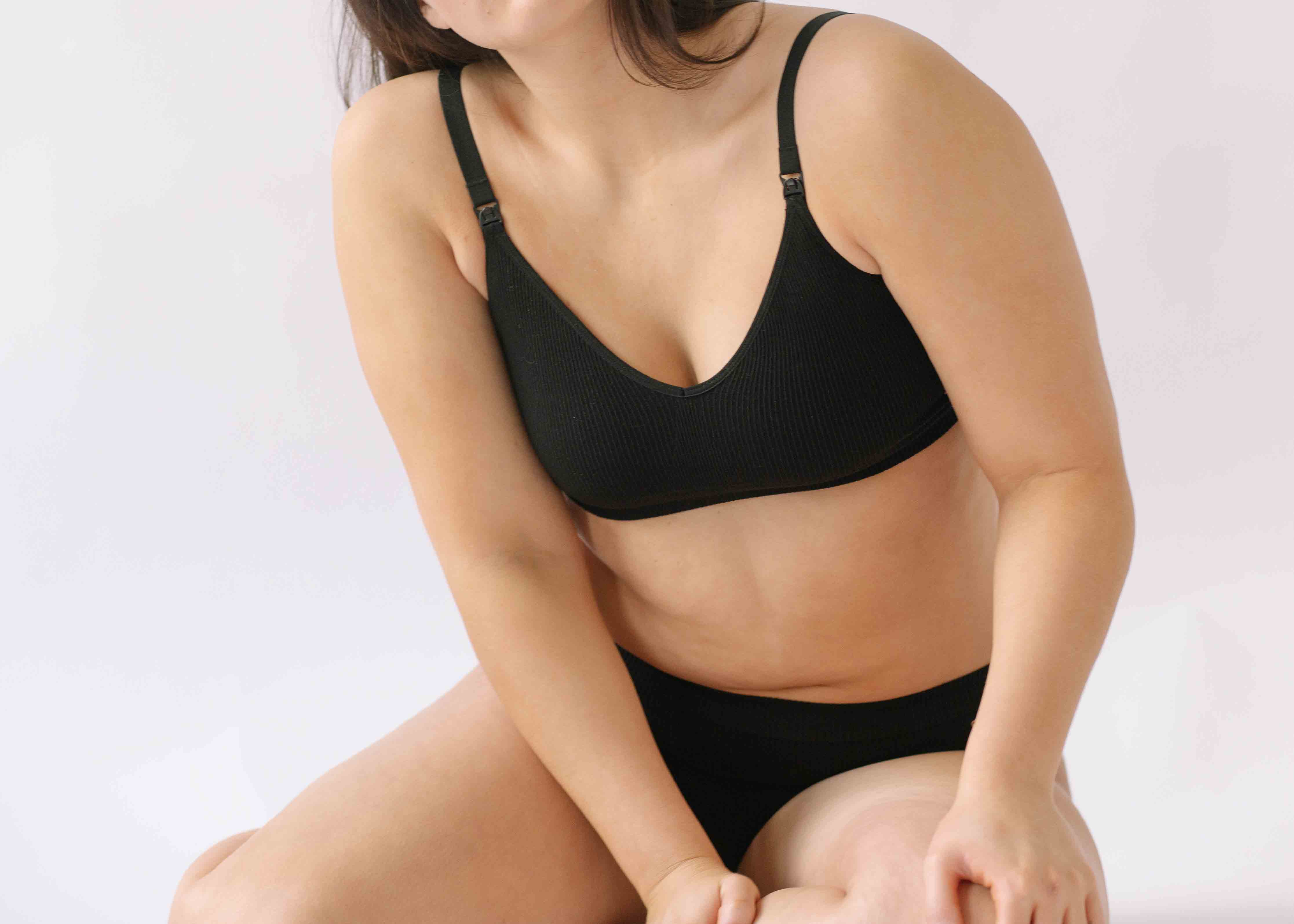 Woman wearing the Six Ada seamless ribbed nursing bra and high waisted knicker. Comfortable and supportive and suitable for pregnancy and breastfeeding.