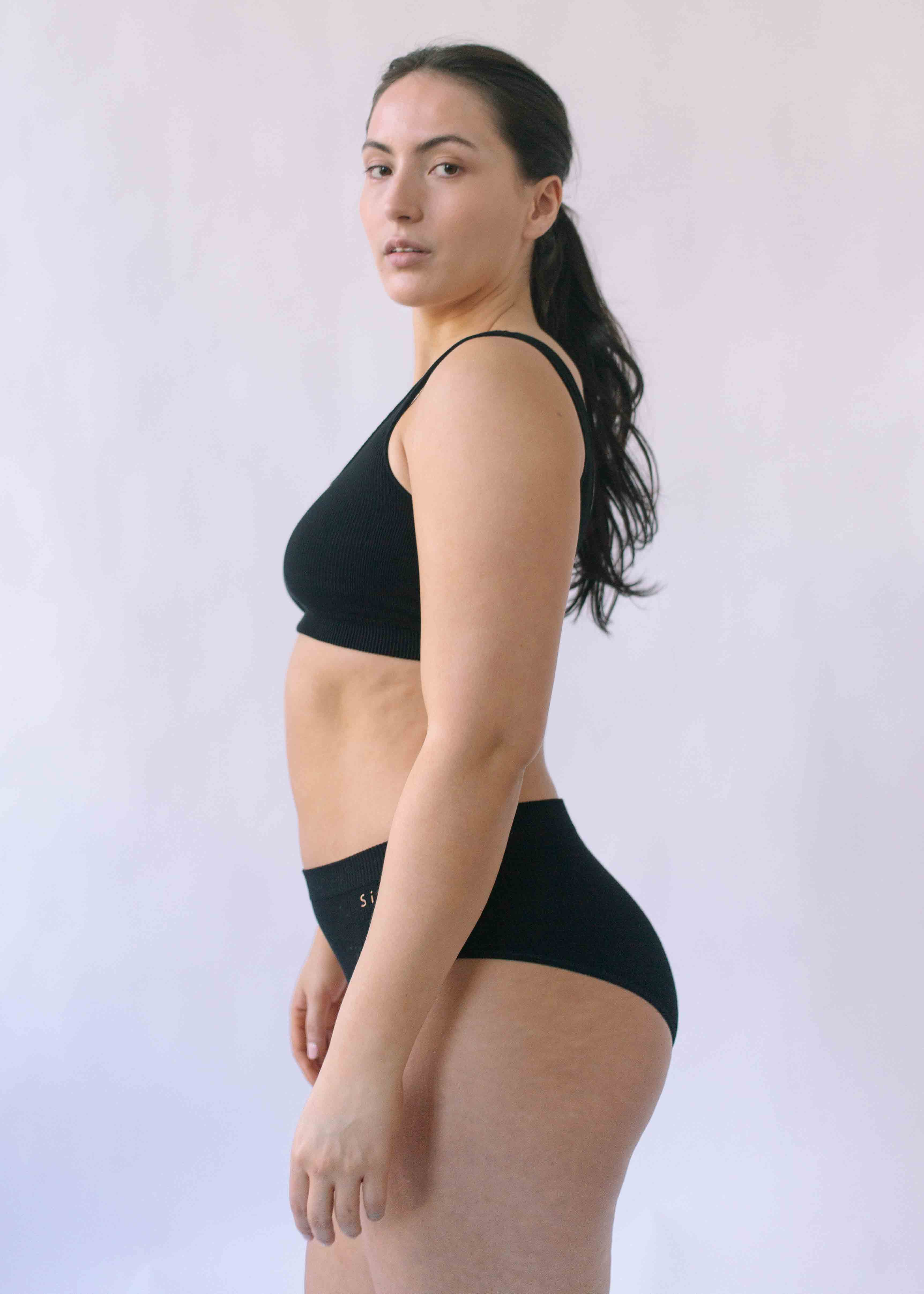 Woman wearing the Six Ada seamless ribbed nursing bra and high waisted knicker. Comfortable and supportive and suitable for pregnancy and breastfeeding.